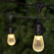 54' Commercial Warm White LED Patio String Light Set with 24 S14 Bulbs on Black Wire, with Drops