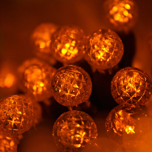 70 G12 Amber LED String Lights, Green Wire, 4" Spacing